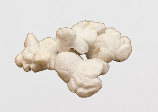 Four butter-coated popped popcorn kernels.