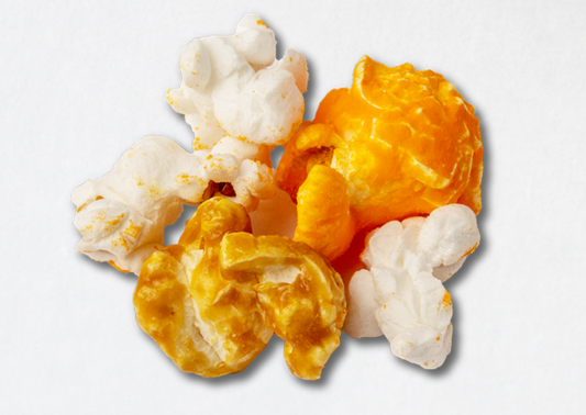Five pieces of popped popcorn kernels. With cheddar, caramel, and butter flavoring.