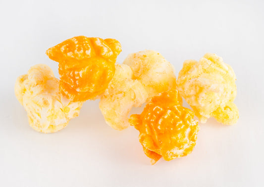 Four pieces of cheese-covered popped popcorn kernels.